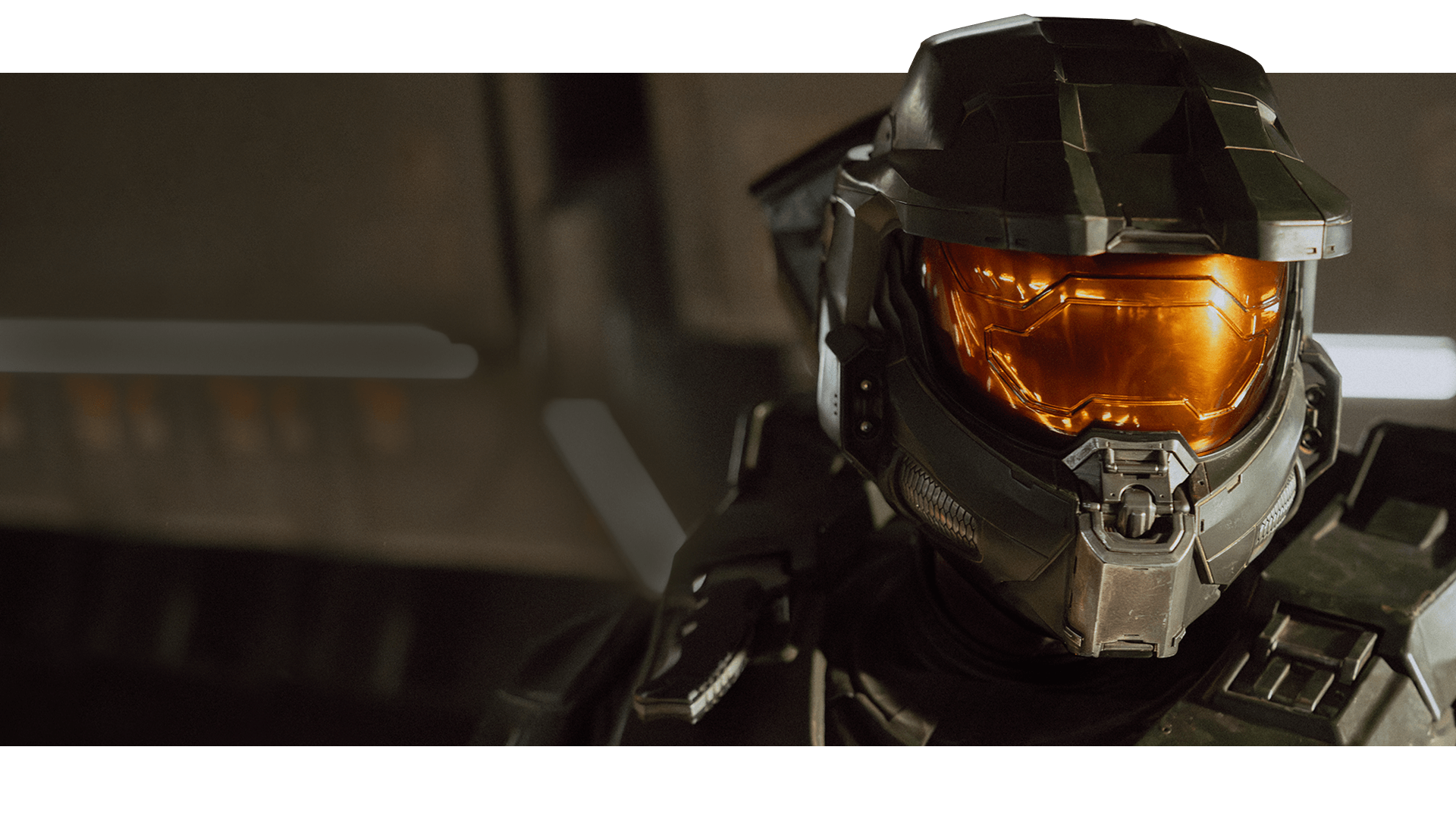 Master Chief moves through a metal corridor.
